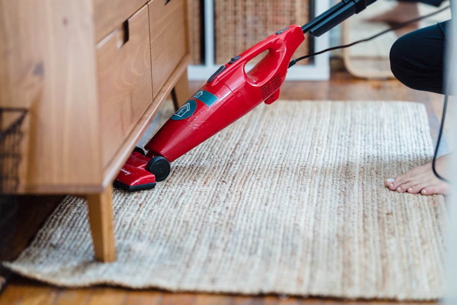 Vacuuming living room carpet